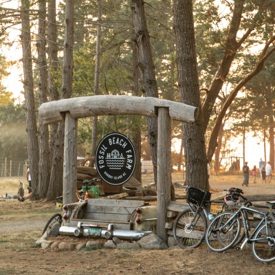 Bikes leaning against Fossil Beach Farm sign